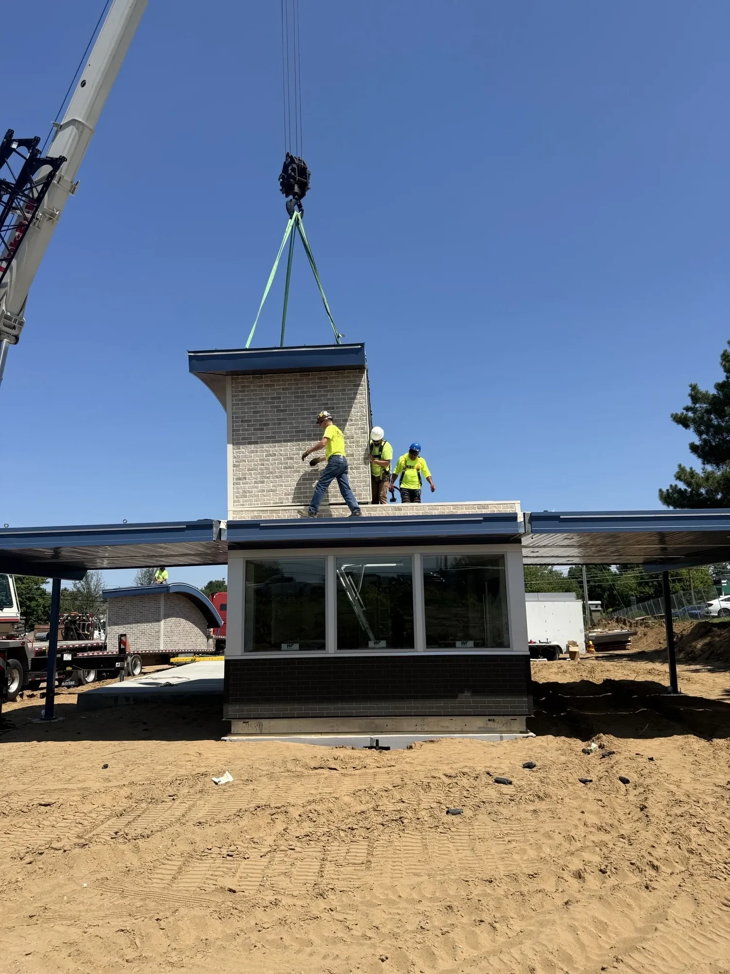 Crews assembling the Clifton Park 7 Brew Coffee building