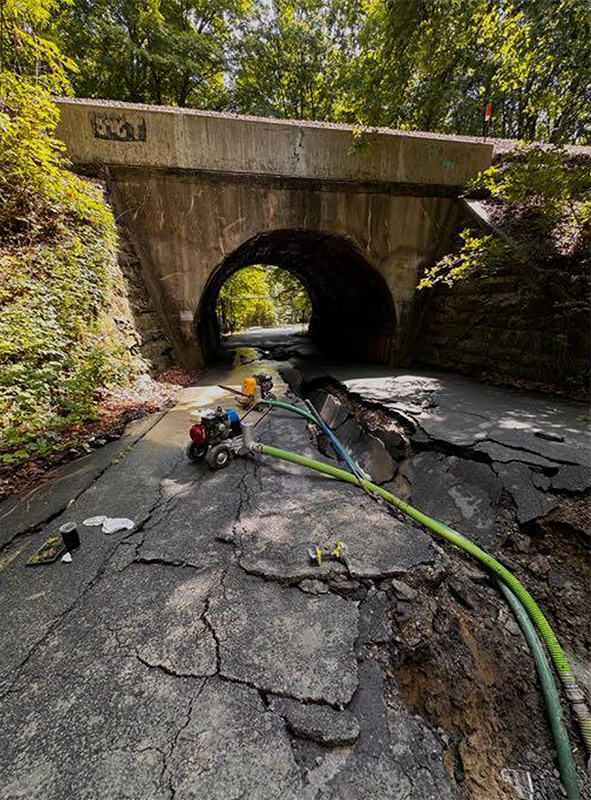 Damaged and eroded section of Carlton Road following a water main break
